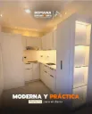 Fabricacion y montura de muebles de cocina en MDF Blanco de 18mm, colocados en piso y en paredes. La parte de respaldo y fondo de gavetas sera estructurada en MDF en blanco de 1/4. Incluye: Los modulos de la parte superior de altura 80cm con puertas y los modulo de la parte inferior de 88cm, terminados en 90cm con el tope, con 1 torre de 3 gavetas, una depensa con hueco para microondas, con puerta en la parte superior con tramos internos y puerta en la parte inferior, pandereta con mueble en la parte superior a la nevera, las bisagras y correderas de cierre lento para puertas y gavetas.